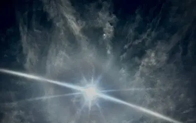 Arizona. Sun blotted out by chemical trails in the sky over Native American land.