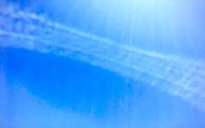 These are leftover from a commercial jet. Shorter length trails are caused by fuel (chemical) additives. The longer and more widespread chemical trails are done by DOD-DARPA jets. The one in photo is from a commercial jet