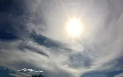 Chemically induced ring around the sun, midday in central Arizona. They started spraying as usual early today and this is the result. Darkened skies and aluminum based particulate sun rings. We better stop this soon!