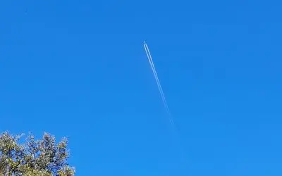 Manosque, France, April 4, 2026: More contrails marring the blue skies of Provence.