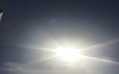 Blocking out the afternoon Sun in Siesta Key Florida. Yes, real evil does exist.