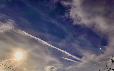 Afternoon sun blotted out by chemtrails in Largo Florida.